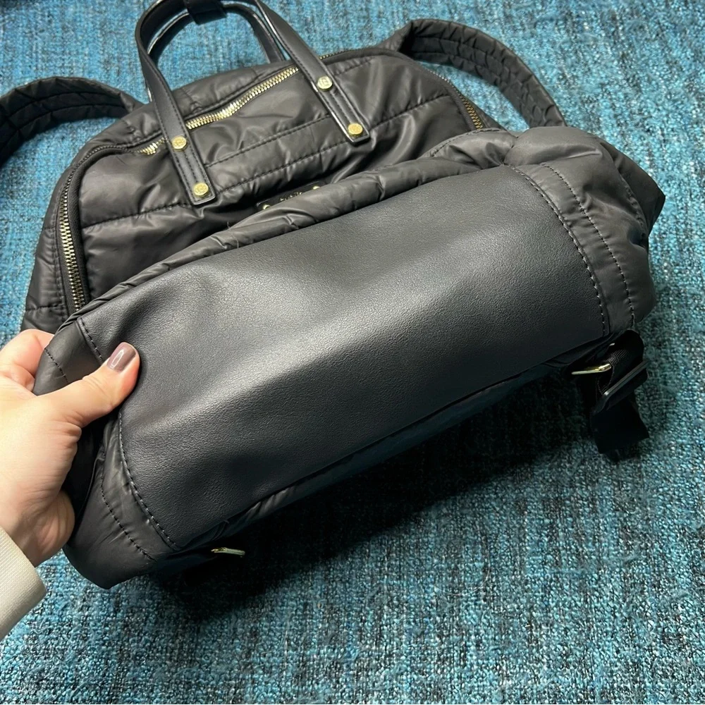 Tutilo Travel Backpack in Black with Gold Quilted Luggage Trolley Sleeve Pocket